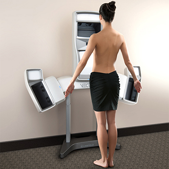 Woman standing in front of Vectra 3D machine